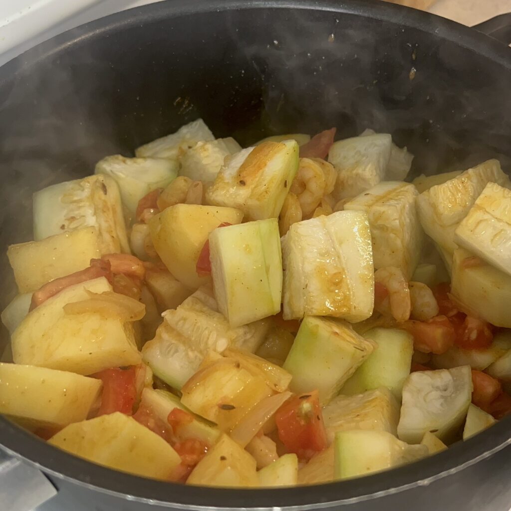 Add potatoes and gourd pieces 