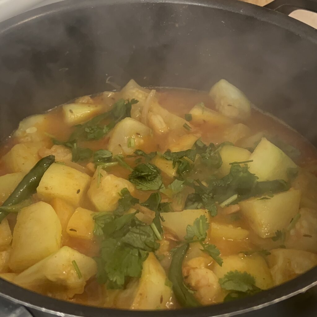 minced cilantro and thai chilli on the gourd curry 
