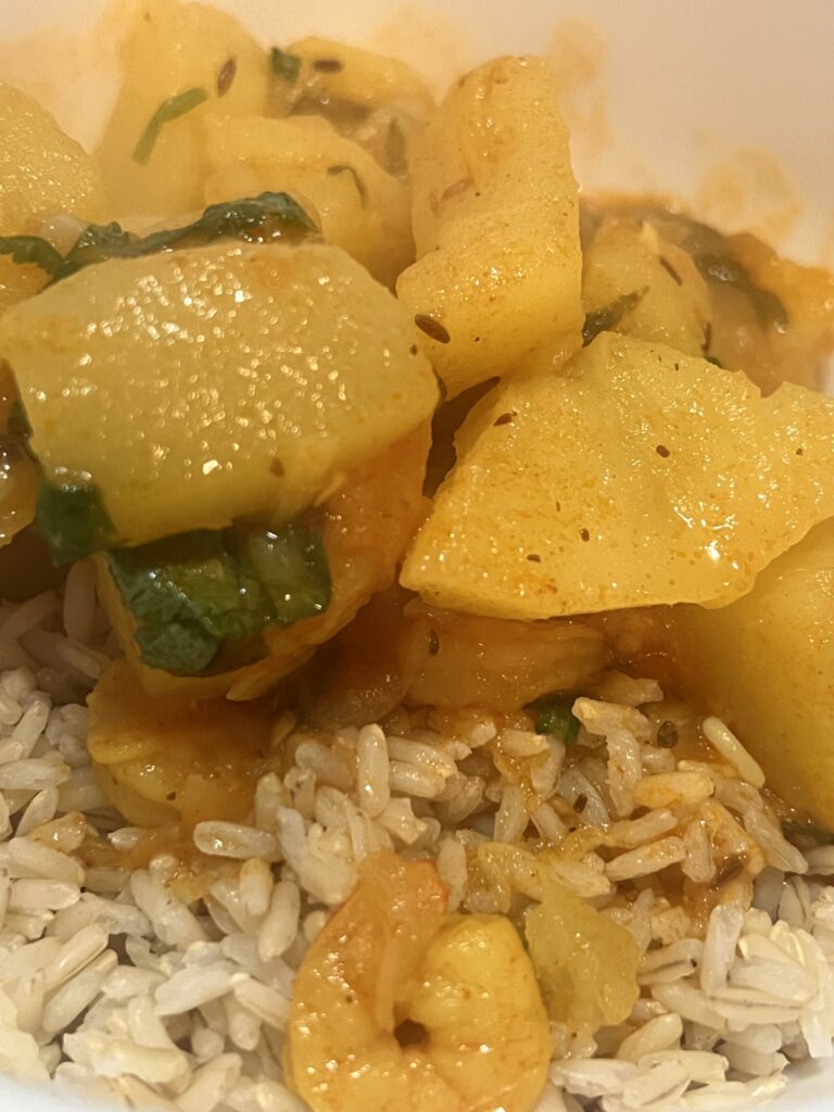 served gourd curry with warm rice 